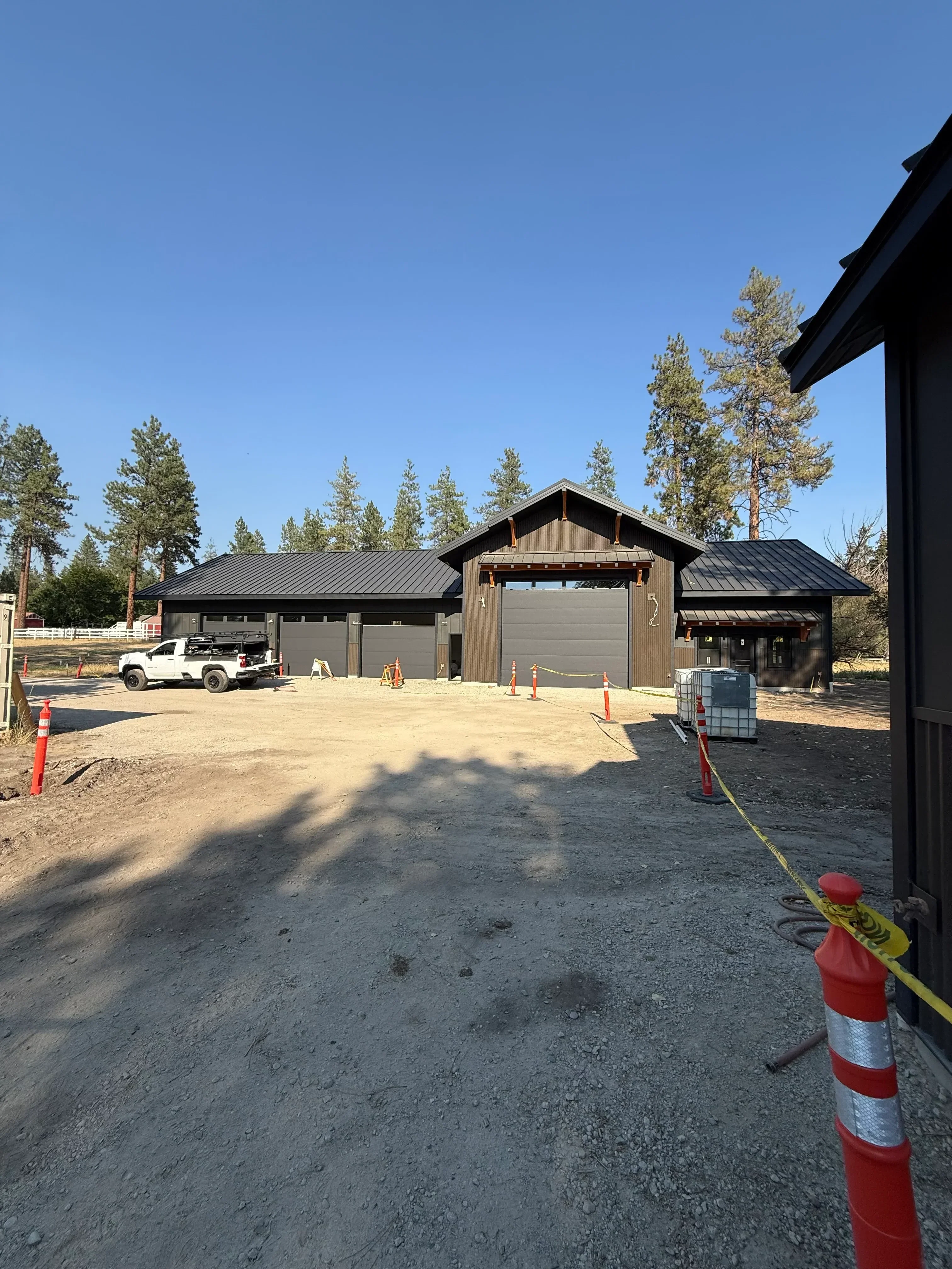 Wood-frame residential addition with metal roof and concrete foundation during construction